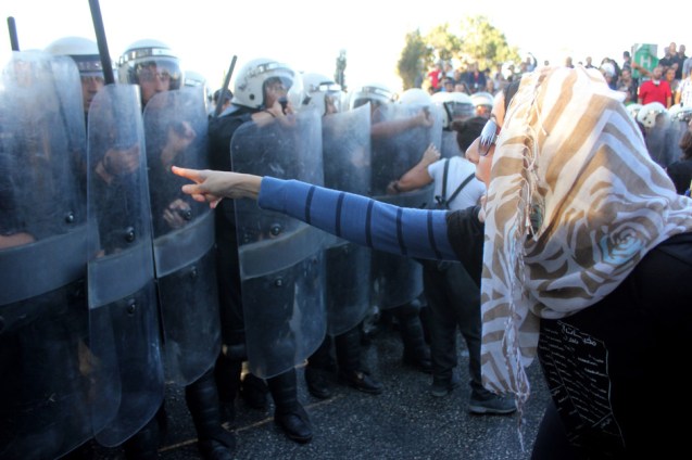 Palestinians in the West Bank city of Ramallah protest against the Palestinian Authority’s negotiations with Israel and coordination with its military and police forces on 28 August, days after Israeli forces shot dead three young men in nearby Qalandiya refugee camp. @Ahmad Al-Bazz / ActiveStills)