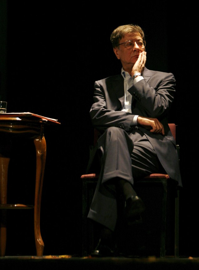 ** FILE ** In this Sunday, July 15, 2007 picture, Palestinian poet Mahmoud Darwish, pauses during a reading in the northern Israeli city of Haifa. A Palestinian presidential aide said Saturday, Aug. 9, 2008 that the renowned poet has died at a hospital in Houston following complications from an open heart surgery © AP Photo/Gil Cohen Magen, Pool)