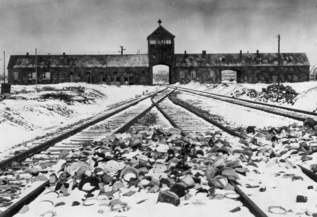 An undated archive photograph shows Auschwitz II-Birkenau main guard house which prisoners called "the gate of death". An undated archive photograph shows Auschwitz II-Birkenau's main guard house which prisoners called "the gate of death" and the railway with the remains of abandoned crockery. The railway, which was built in 1944, was the last stop for the trains bringing Jews to the death camp. © REUTERS/HO-AUSCHWITZ MUSEUM