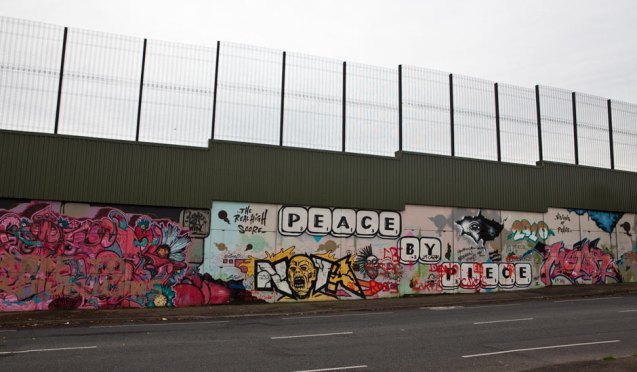 The Cupar Way 'peace wall', which divides the Protestant Shankill Road from the Catholic Falls Road. © Photograph: Antonio Olmos for the Observer