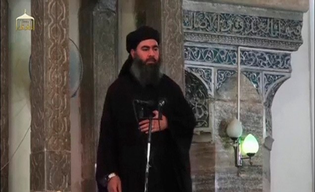 A man purported to be the reclusive leader of the militant Islamic State Abu Bakr al-Baghdadi has made what would be his first public appearance at a mosque in the centre of Iraq's second city, Mosul, according to a video recording posted on the Internet on July 5, 2014, in this still image taken from video. There had previously been reports on social media that Abu Bakr al-Baghdadi would make his first public appearance since his Islamic State in Iraq and the Levant (ISIL) changed its name to the Islamic State and declared him caliph. The Iraqi government denied that the video, which carried Friday's date, was credible. It was also not possible to immediately confirm the authenticity of the recording or the date when it was made. REUTERS/Social Media Website via Reuters TV (IRAQ - Tags: POLITICS) ATTENTION EDITORS - THIS IMAGE HAS BEEN SUPPLIED BY A THIRD PARTY. IT IS DISTRIBUTED, EXACTLY AS RECEIVED BY REUTERS, AS A SERVICE TO CLIENTS. REUTERS IS UNABLE TO INDEPENDENTLY VERIFY THE CONTENT OF THIS VIDEO, WHICH HAS BEEN OBTAINED FROM A SOCIAL MEDIA WEBSITE © Reuters