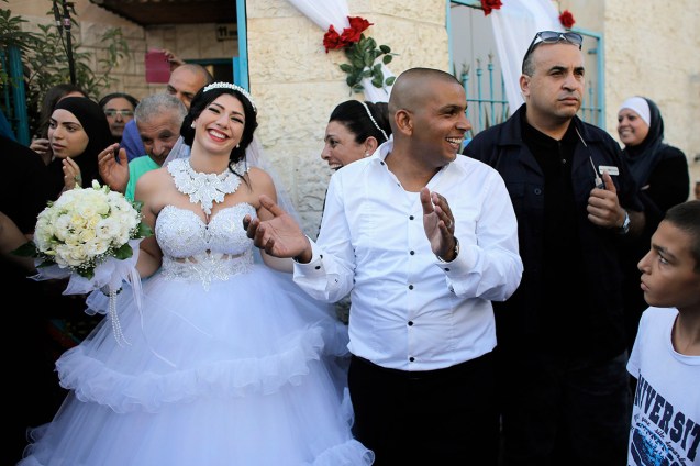 Mahmoud Mansour and Maral Malka celebrate before their wedding in Jaffa, south of Tel Aviv. More than 200 far-right Israeli protesters tried to disrupt the union of a Jewish woman and a Muslim man © Reuters | International Business Times